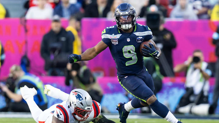 Feb 8, 2026; Santa Clara, CA, USA; Seattle Seahawks running back Kenneth Walker III (9) runs the ball against New England Patriots defensive end Milton Williams (97) during Super Bowl LX at Levi's Stadium. Mandatory Credit: Mark J. Rebilas-Imagn Images