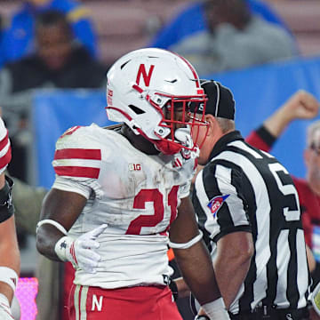 Emmett Johnson and TJ Lateef put together strong performances at UCLA to earn Big Ten weekly honors.