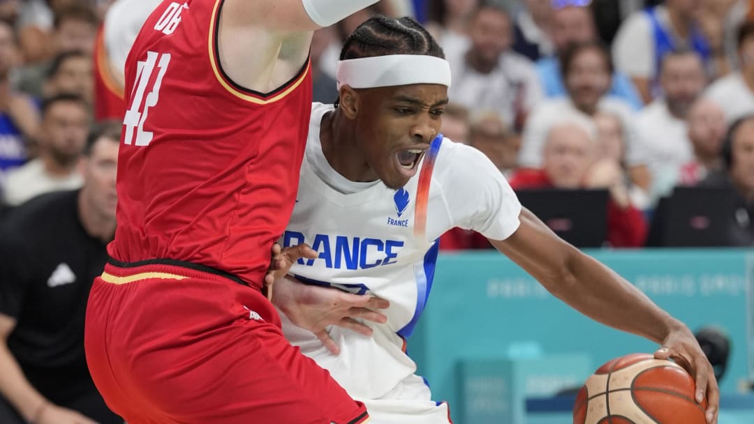 Aug 2, 2024; Villeneuve-d'Ascq, France; France small forward Bilal Coulibaly (99) controls the ball against Germany shooting guard Andreas Obst (42) in the second half in a men’s group B basketball game during the Paris 2024 Olympic Summer Games at Stade Pierre-Mauroy. Mandatory Credit: John David Mercer-USA TODAY Sports