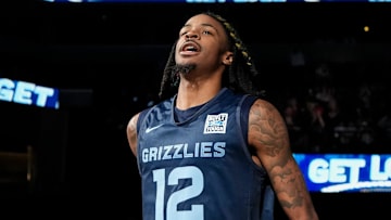 Grizzlies' Ja Morant (12) runs on the court as he is introduced during open practice at FedExForum in Memphis, Tenn., on Sunday, October 6, 2024.