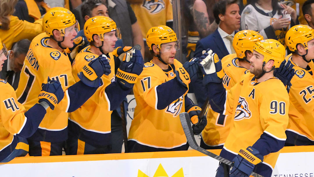 Oct 9, 2025; Nashville, Tennessee, USA; Nashville Predators center Ryan O'Reilly (90) celebrates with his teammates after scoring a goal against the Columbus Blue Jackets during the third period at Bridgestone Arena. Mandatory Credit: Steve Roberts-Imagn Images