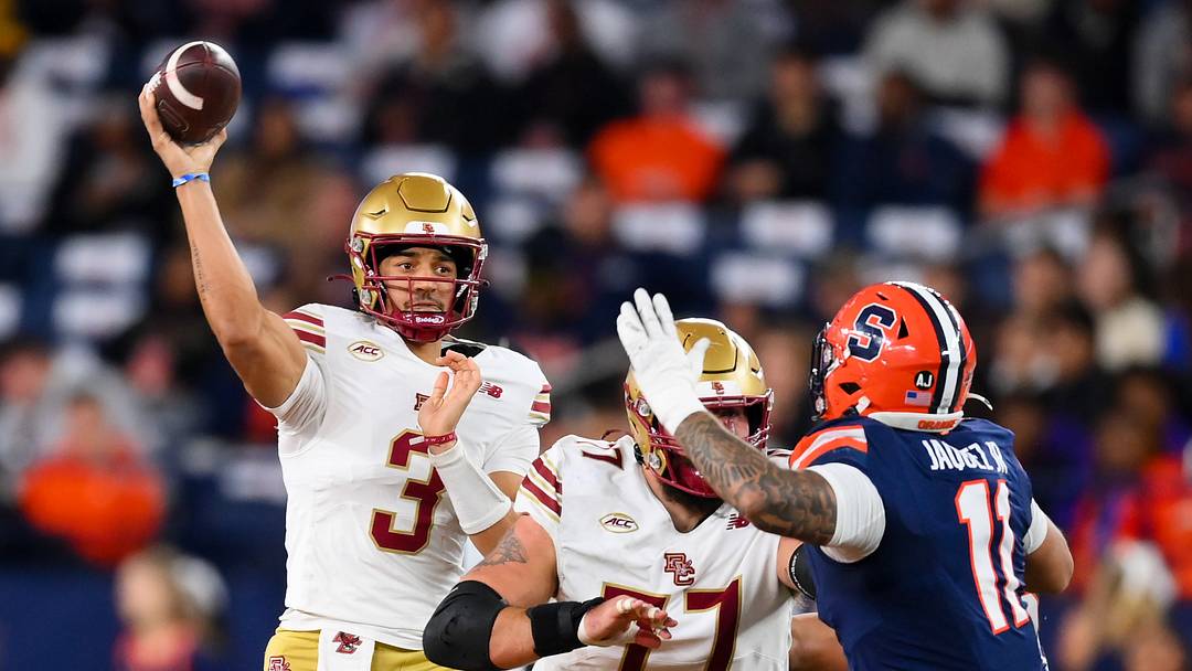 Nov 29, 2025; Syracuse, New York, USA; Boston College Eagles quarterback Grayson James (3) passes the ball as Syracuse Orange defensive lineman Denis Jaquez Jr. (11) defends during the first half at the JMA Wireless Dome. Mandatory Credit: Rich Barnes-Imagn Images