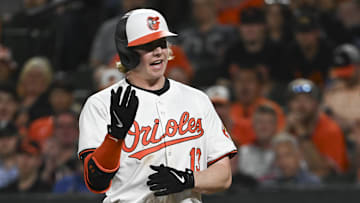 May 1, 2024; Baltimore, Maryland, USA;  Baltimore Orioles outfielder Heston Kjerstad (13) reacts after being hit with a eighth inning pitch against the New York Yankees at Oriole Park at Camden Yards. Mandatory Credit: Tommy Gilligan-Imagn Images