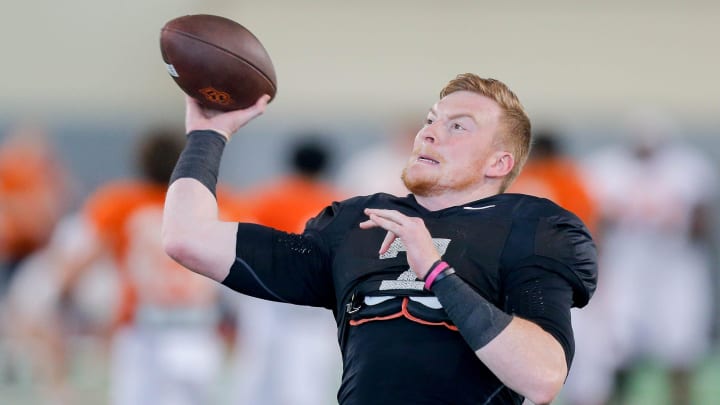 Alan Bowman (7) runs drills during an Oklahoma State football practice in Stillwater, Okla., on Tuesday, April 23, 2024.