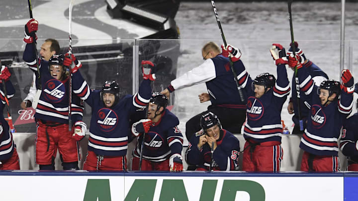 Oct 26, 2019; Regina, Saskatchewan, CAN; Winnipeg Jets react to a third period goal during the 2019 Heritage Classic outdoor hockey game against the Calgary Flames at Mosaic Stadium. Jets won 2-1. Mandatory Credit: Candice Ward-Imagn Images