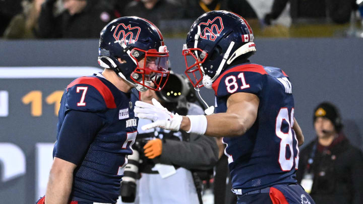 Nov 19, 2023; Hamilton, Ontario, CAN; Montreal Alouettes wide receiver Austin Mack (81) celebrates with quarterback Cody Fajardo (7) after scoring a touchdown against the Winnipeg Blue Bombers in the second half at Tim Hortons Field. Mandatory Credit: Dan Hamilton-USA TODAY Sports