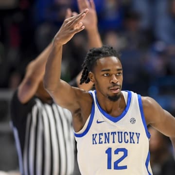 Mar 15, 2024; Nashville, TN, USA; Kentucky Wildcats guard Antonio Reeves (12) celebrates his three point basket against the Texas A&M Aggies during the first half at Bridgestone Arena. Mandatory Credit: Steve Roberts-USA TODAY Sports