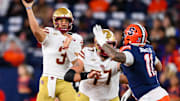 Nov 29, 2025; Syracuse, New York, USA; Boston College Eagles quarterback Grayson James (3) passes the ball as Syracuse Orange defensive lineman Denis Jaquez Jr. (11) defends during the first half at the JMA Wireless Dome. Mandatory Credit: Rich Barnes-Imagn Images