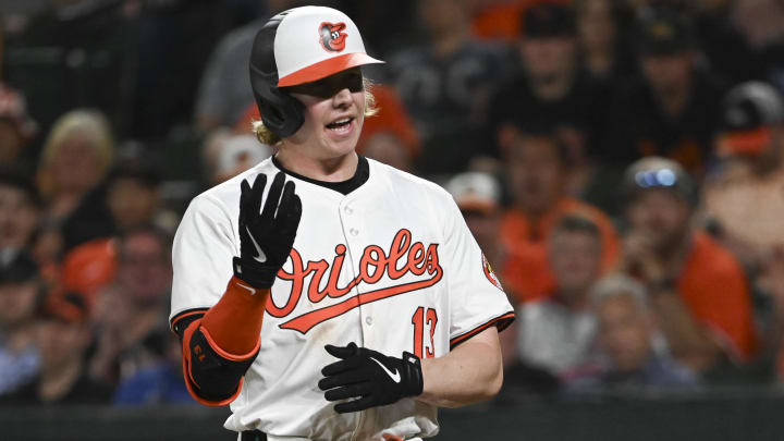 May 1, 2024; Baltimore, Maryland, USA;  Baltimore Orioles outfielder Heston Kjerstad (13) reacts after being hit with a eighth inning pitch against the New York Yankees at Oriole Park at Camden Yards.