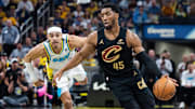 May 11, 2025; Indianapolis, Indiana, USA; Cleveland Cavaliers guard Donovan Mitchell (45) dribbles the ball while Indiana Pacers guard Andrew Nembhard (2) defends during game four of the second round for the 2025 NBA Playoffs at Gainbridge Fieldhouse. Mandatory Credit: Trevor Ruszkowski-Imagn Images