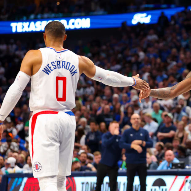 Apr 28, 2024; Dallas, Texas, USA;  LA Clippers guard Russell Westbrook (0) celebrates with LA Clippers forward Paul George (13) during the second half against the Dallas Mavericks during game four of the first round for the 2024 NBA playoffs at American Airlines Center. Mandatory Credit: Kevin Jairaj-USA TODAY Sports