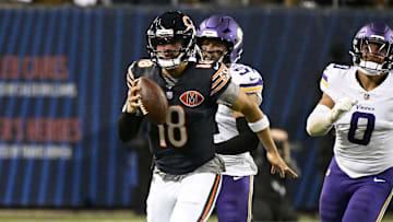 Chicago Bears quarterback Caleb Williams rushes the ball against the Minnesota Vikings during the second half at Soldier Field.