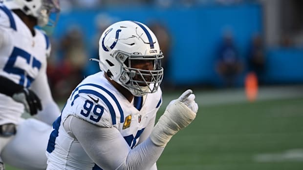 Colts defensive tackle DeForest Buckner (all-white uniform;blue trim) celebrates after a big play. 