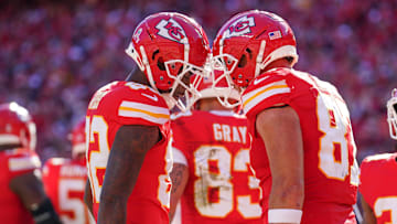 Nov 10, 2024; Kansas City, Missouri, USA; Kansas City Chiefs tight end Travis Kelce (87) celebrates with wide receiver Justyn Ross (82) after scoring against the Denver Broncos during the game at GEHA Field at Arrowhead Stadium. Mandatory Credit: Denny Medley-Imagn Images