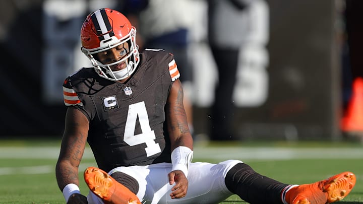 Cleveland Browns quarterback Deshaun Watson sits on the ground during a game vs. the Dallas Cowboys.