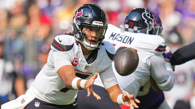 Houston Texans quarterback C.J. Stroud (7) pitches the ball