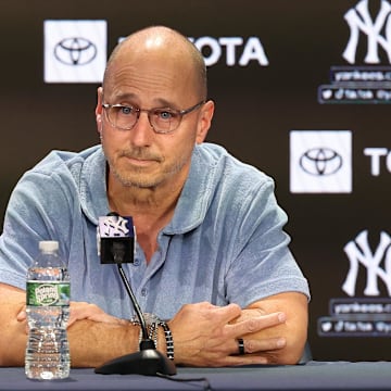 Aug 23, 2023; Bronx, New York, USA; New York Yankees general manager Brian Cashman talks with the media before the game between the Yankees and the Washington Nationals at Yankee Stadium. Mandatory Credit: Vincent Carchietta-Imagn Images