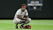 Arkansas Razorbacks center fielder Justin Thomas Jr. was shocked after the Hogs blew a two-run lead in the ninth inning against the LSU Tigers at Charles Schwab Field in Omaha, Neb.