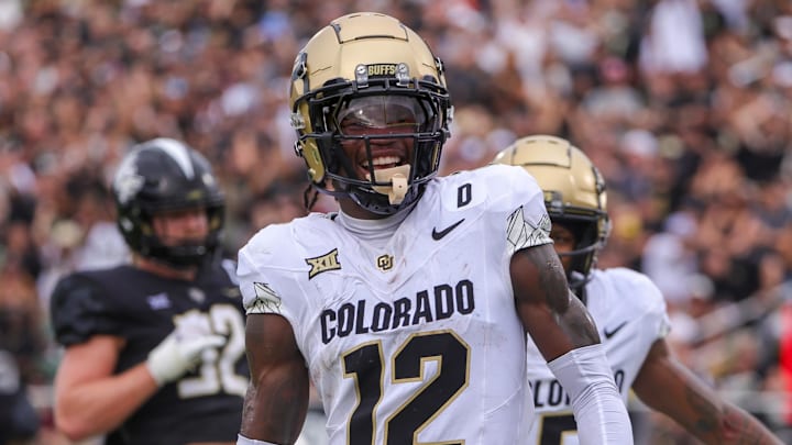 Sep 28, 2024; Orlando, Florida, USA; Colorado Buffaloes wide receiver Travis Hunter (12) scores a touchdown against the UCF Knights during the first quarter at FBC Mortgage Stadium. Mandatory Credit: Mike Watters-Imagn Images Sep 28, 2024; Orlando, Florida, USA; Colorado Buffaloes wide receiver Travis Hunter (12) scores a touchdown against the UCF Knights during the first quarter at FBC Mortgage Stadium. Mandatory Credit: Mike Watters-Imagn Images
