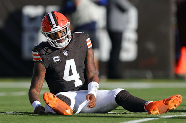 Quarterback on the ground after play.