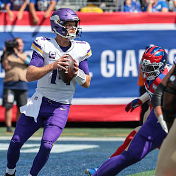 Sep 8, 2024; East Rutherford, New Jersey, USA; Minnesota Vikings quarterback Sam Darnold (14) drops back to pass during the first quarter against the New York Giants at MetLife Stadium. Mandatory Credit: Vincent Carchietta-Imagn Images