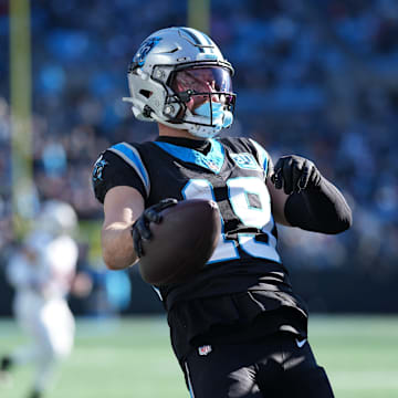 Dec 22, 2024; Charlotte, North Carolina, USA; Carolina Panthers wide receiver Adam Thielen (19) and running back Mike Boone (34) celebrate Thielen scoring a touchdown catch against the Arizona Cardinals during the second quarter at Bank of America Stadium.
