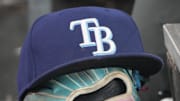 Sep 26, 2025; Toronto, Ontario, CAN; The hat and glove of Tampa Bay Rays third baseman Junior Caminero (13) in the dugout during the game against the Toronto Blue Jays at Rogers Centre. 