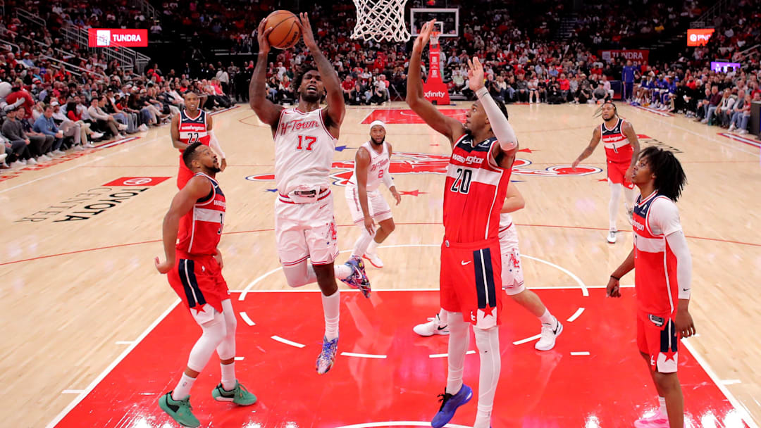 Nov 12, 2025; Houston, Texas, USA; Houston Rockets forward Tari Eason (17) shoots inside against Washington Wizards center Alex Sarr (20) during the fourth quarter at Toyota Center. Mandatory Credit: Erik Williams-Imagn Images