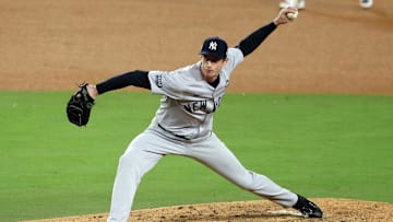 Oct 26, 2024; Los Angeles, California, USA; New York Yankees pitcher Tim Hill (54) throws a pitch against the Los Angeles Dodgers in the sixth inning for game two of the 2024 MLB World Series at Dodger Stadium. Mandatory Credit: Kiyoshi Mio-Imagn Images