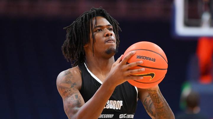 Calvin Russell III, the SU two-sport star who is rehabbing an injury, says he will play for Syracuse basketball next season.