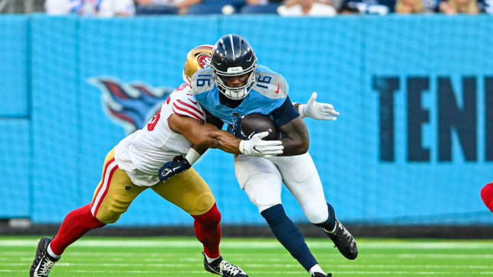 Aug 10, 2024; Nashville, Tennessee, USA;  Tennessee Titans wide receiver Treylon Burks (16) runs through a tackle against the San Francisco 49ers during the first half at Nissan Stadium. Mandatory Credit: Steve Roberts-USA TODAY Sports