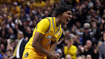 Missouri Tiger guard Anthony Robinson II (0), celebrates after hitting a three versus rival Kansas.