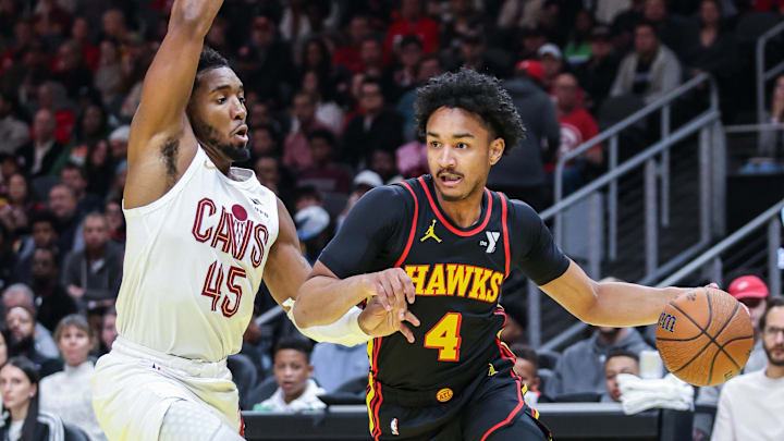 Atlanta Hawks guard Kobe Bufkin drives the ball towards the goal against Cleveland Cavaliers guard Donovan Mitchell