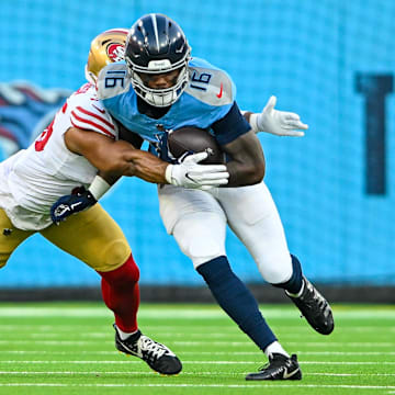 Aug 10, 2024; Nashville, Tennessee, USA;  Tennessee Titans wide receiver Treylon Burks (16) runs through a tackle against the San Francisco 49ers during the first half at Nissan Stadium. Mandatory Credit: Steve Roberts-Imagn Images