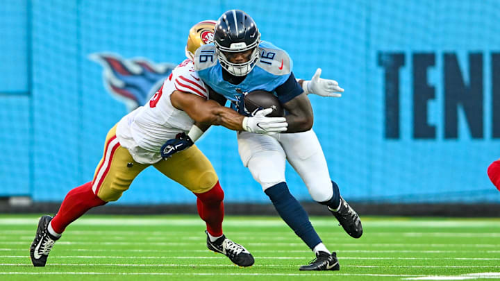 Aug 10, 2024; Nashville, Tennessee, USA;  Tennessee Titans wide receiver Treylon Burks (16) runs through a tackle against the San Francisco 49ers during the first half at Nissan Stadium. Mandatory Credit: Steve Roberts-Imagn Images