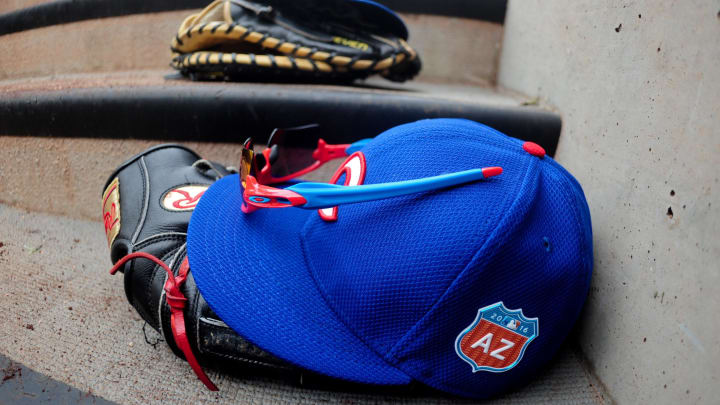 Mar 6, 2016; Salt River Pima-Maricopa, AZ, USA; Chicago Cubs hats and gloves sit in the dugout prior to the game against the Arizona Diamondbacks at Salt River Fields at Talking Stick.