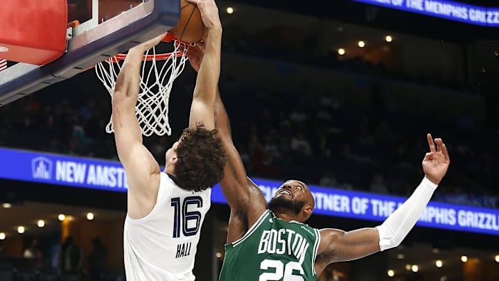 Oct 8, 2025; Memphis, Tennessee, USA; Boston Celtics forward Xavier Tillman Sr. (26) blocks a shot attempt by Memphis Grizzlies center PJ Hall (16) during the third quarter at FedExForum. Mandatory Credit: Petre Thomas-Imagn Images