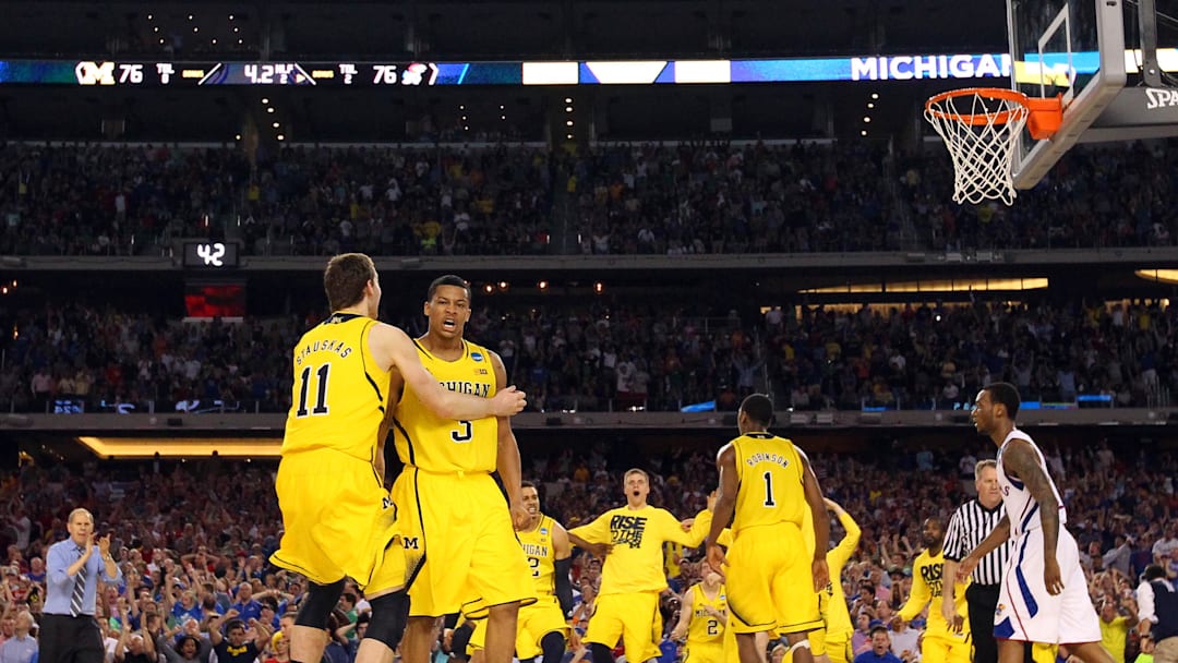 Mar 29, 2013; Arlington, TX, USA; Michigan Wolverines guard Trey Burke (3) celebrates with Nik Stauskas (11) after hitting a three-point shot to tie the game with six seconds against the Kansas Jayhawks in the second half during the semifinals of the South regional of the 2013 NCAA Tournament at Cowboys Stadium. Mandatory Credit: Kevin Jairaj-Imagn Images