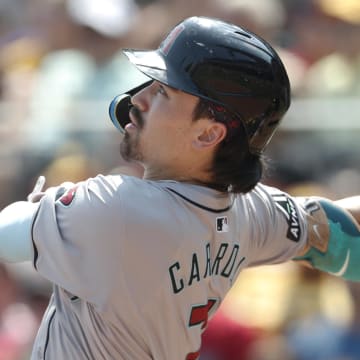 Aug 4, 2024; Pittsburgh, Pennsylvania, USA;  Arizona Diamondbacks right fielder Corbin Carroll (7) hits a triple against the Pittsburgh Pirates during the sixth inning at PNC Park. Mandatory Credit: Charles LeClaire-USA TODAY Sports