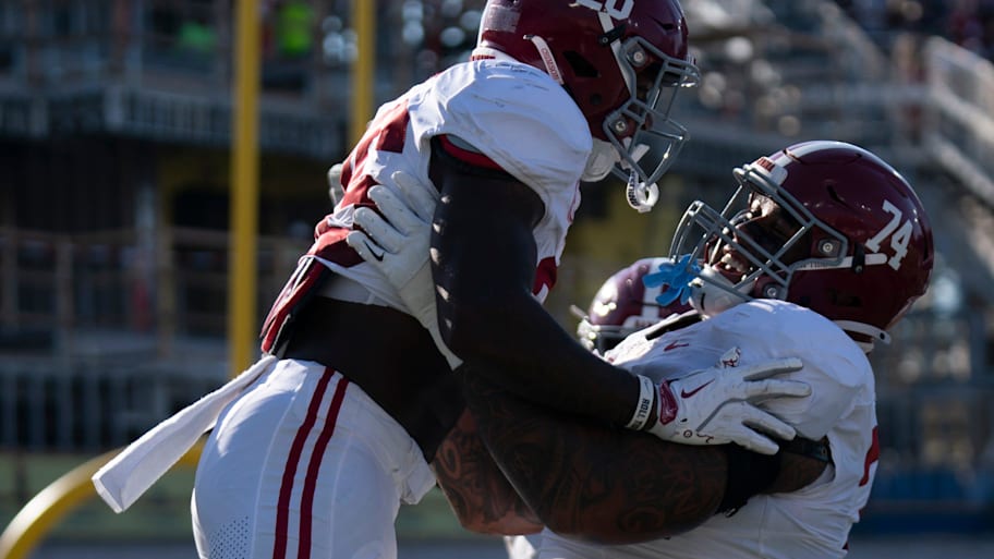 Alabama Crimson Tide running back Jam Miller (26) and Alabama Crimson Tide offensive lineman Kadyn Proctor (74) celebrate Miller's touchdown against the Vanderbilt Commodores during their game at Vanderbilt Stadium in Nashville, Tenn., Saturday, Oct. 5, 2024. | Denny Simmons / The Tennessean / USA TODAY NETWORK via Imagn Images