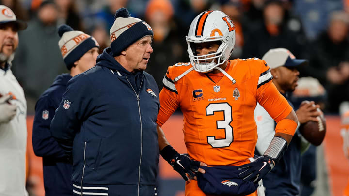 Dec 24, 2023; Denver, Colorado, USA; Denver Broncos head coach Sean Payton talks with quarterback Russell Wilson (3) before the game against the New England Patriots at Empower Field at Mile High. Mandatory Credit: Isaiah J. Downing-USA TODAY Sports