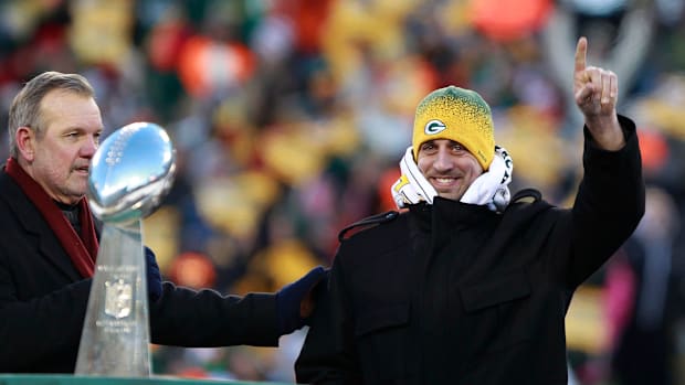 Aaron Rodgers celebrates the Super Bowl XLV title with Green Bay Packers fans during a Return to Titletown Celebration.