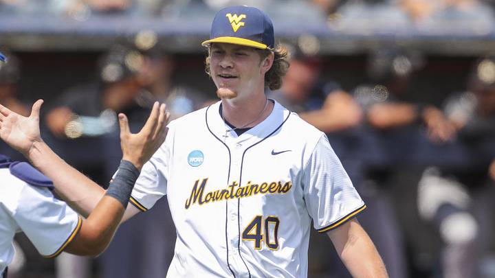 Jun 5, 2026; Morgantown, WV, USA; West Virginia Mountaineers pitcher Carson Estridge (40) celebrates with West Virginia Mountaineers catcher Matthew Graveline (0) after defeating the Cal Poly Mustangs  at Kendrick Family Ballpark. Mandatory Credit: Ben Queen-Imagn Images