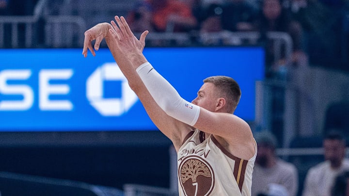 Mar 27, 2026; San Francisco, California, USA; Golden State Warriors center Kristaps Porzingis (7) makes a three point basket against the Washington Wizards during the first quarter at Chase Center. Mandatory Credit: Neville E. Guard-Imagn Images