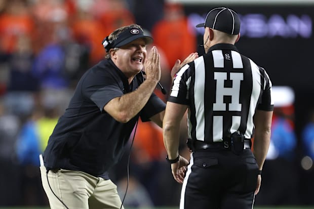 Georgia Bulldogs head coach Kirby Smart tries to tell an official that he did not call a time out during the fourth quarter.