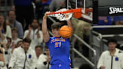 Apr 7, 2025; San Antonio, TX, USA; Florida Gators forward Alex Condon (21) dunks the ball against the Houston Cougars during the second half in the national championship game of the Final Four of the 2025 NCAA Tournament at the Alamodome.