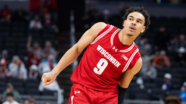 Mar 14, 2025; Indianapolis, IN, USA; Wisconsin Badgers guard John Tonje (9)  celebrates a made shot in the second half against the UCLA Bruins against the UCLA Bruins at Gainbridge Fieldhouse. Mandatory Credit: Trevor Ruszkowski-Imagn Images