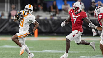 Sep 7, 2024; Charlotte, North Carolina, USA; Tennessee Volunteers wide receiver Squirrel White (3) runs as North Carolina State Wolfpack safety Bishop Fitzgerald (7) defends during the second half at the Dukes Mayo Classic at Bank of America Stadium. Mandatory Credit: Jim Dedmon-Imagn Images