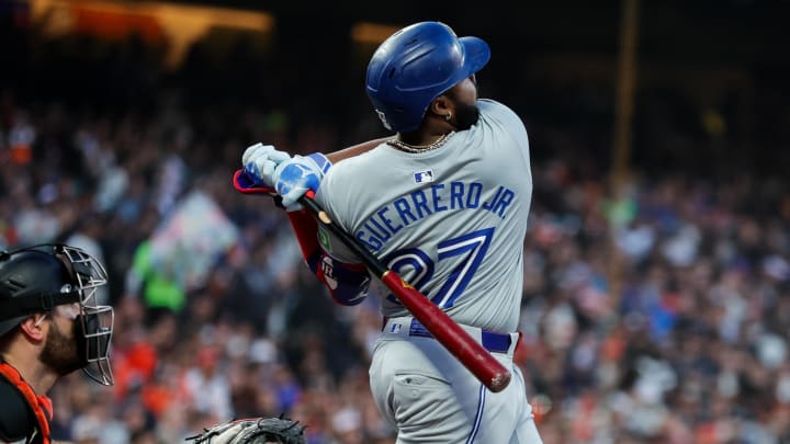 Jul 10, 2024; San Francisco, California, USA; Toronto Blue Jays first base Vladimir Guerrero Jr. (27) hits a double during the sixth inning against the San Francisco Giants at Oracle Park.