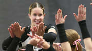 Purdue Boilermakers outside hitter Kenna Wollard (4) high-fives teammates 